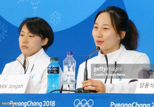 Park Jong Ah of South Korea and fellow member of the unified Korean team Jong Su Hyon of North Korea attend a press conference after the team's 8-0...