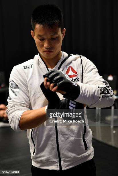 Ben Nguyen puts on his gloves backstage during the UFC 221 event at Perth Arena on February 11, 2018 in Perth, Australia.