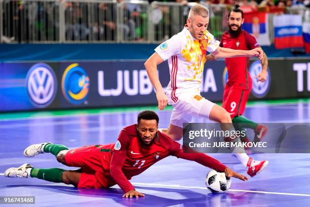 Spains Miguelin vies with Portugals Pany Varela during the European Futsal Championship final match between Portugal and Spain at Arena Stozice in...