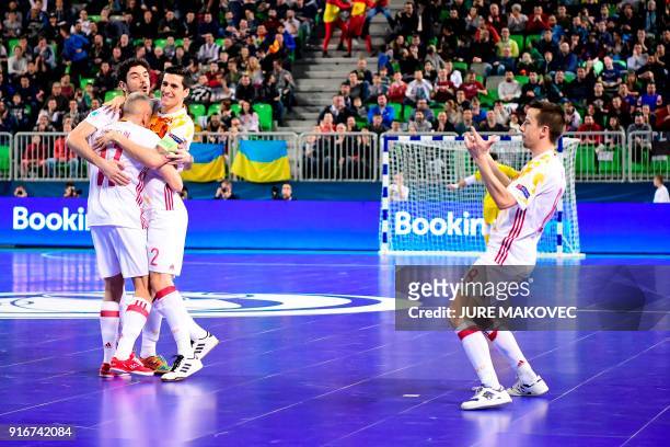 Spains players celebrate after scoring a goal during the European Futsal Championship final match between Portugal and Spain at Arena Stozice in...