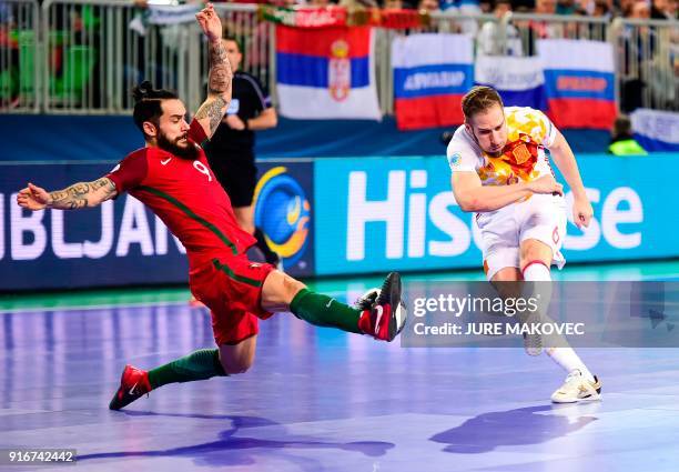 Portugals Joao Matos blocks a shot by Spains Solano during the European Futsal Championship final match between Portugal and Spain at Arena Stozice...