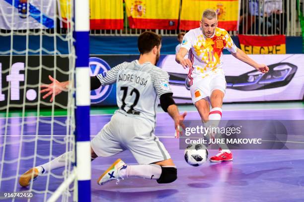 Spains Miguelin vies with Portugals goalkeeper Andre Sousa during the European Futsal Championship final match between Portugal and Spain at Arena...