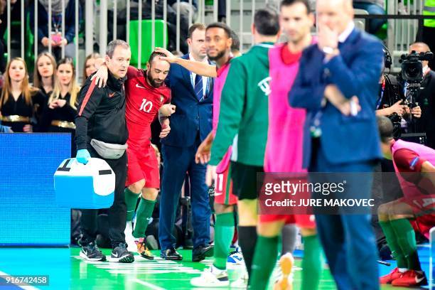 Portugals Ricardinho leaves the pitch due to an injury during the European Futsal Championship final match between Portugal and Spain at Arena...