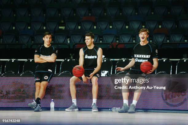 Derone Raukawa, Tom Abercrombie and Finn Delany of the Breakers look on during warm up prior to the round 18 NBL match between the New Zealand...