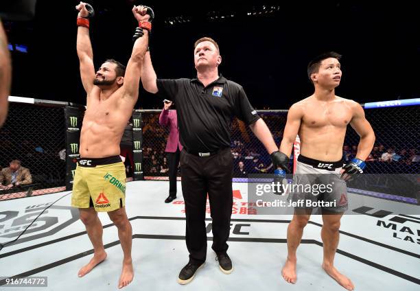 Jussier Formiga of Brazil celebrates his submission victory over Ben Nguyen in their flyweight bout during the UFC 221 event at Perth Arena on...