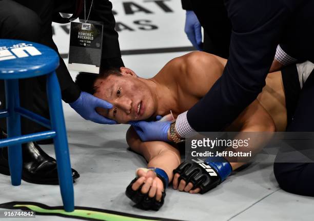 Doctors check on Ben Nguyen after being submitted by Jussier Formiga of Brazil in their flyweight bout during the UFC 221 event at Perth Arena on...