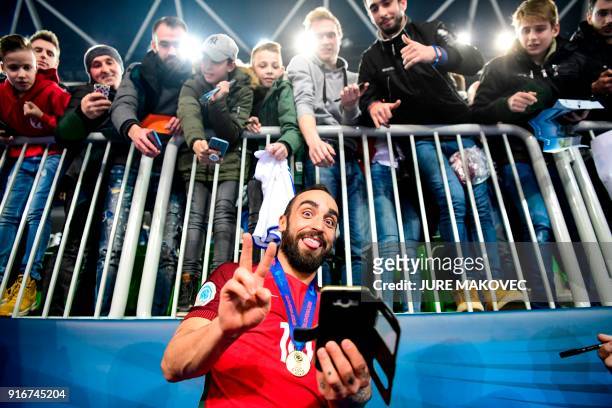 Portugals Ricardinho celebrates with fans after winning the European Futsal Championship at Arena Stozice in Ljubljana, Slovenia on February 10,...
