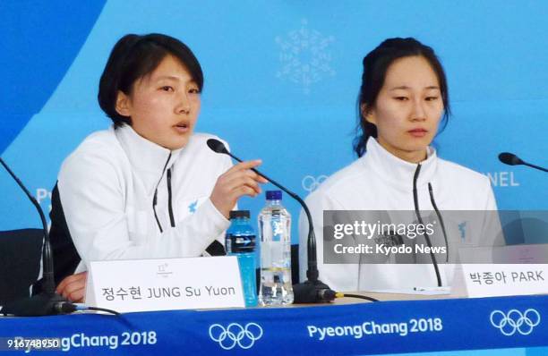 Jong Su Hyon of North Korea and fellow member of the unified Korean team Park Jong Ah of South Korea attend a press conference after the team's 8-0...