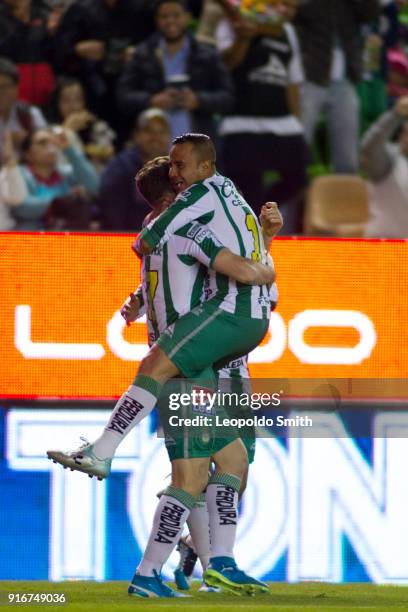 Mauro Beselli of Leon celebrates after scoring the first goal of his team with Luis Montes during the 6th round match between Leon and Puebla as part...