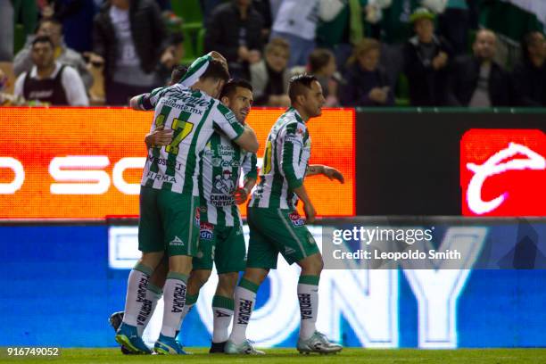 Mauro Beselli of Leon celebrates after scoring the first goal of his team with Fernando Navarro and Luis Montes during the 6th round match between...
