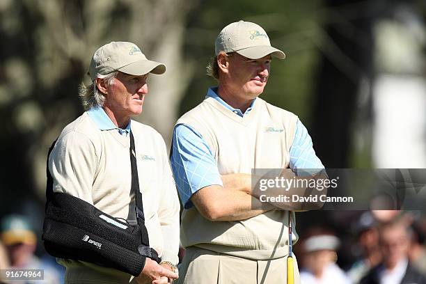 Greg Norman of Australia and the captain of the International Team with Ernie Els of South Africa at the 9th hole during the Day Two Fourball Matches...