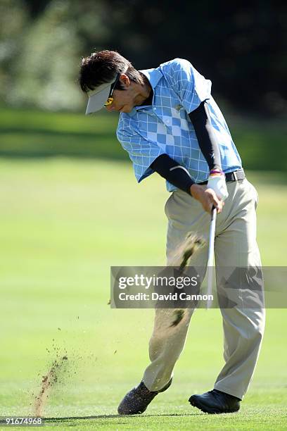 Ryo Ishikawa of Japan and the International Team hits his second shot at the 7th hole during the Day Two Fourball Matches in The Presidents Cup at...