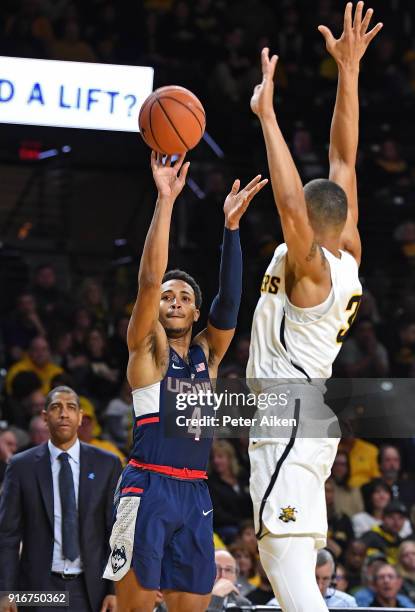 Jalen Adams of the Connecticut Huskies puts up a shot against C.J. Keyser of the Wichita State Shockers during the second half on February 10, 2018...