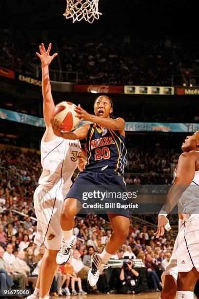 Briann January of the Indiana Fever shoots against Nicole Ohlde of the Phoenix Mercury during Game Five of the WNBA Finals on October 9, 2009 at US...