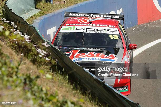 David Sieders driver of the Jesus All About Life/SRT Team crashes into the wall at the the Cutting during pratice for the Bathurst 1000, which is...