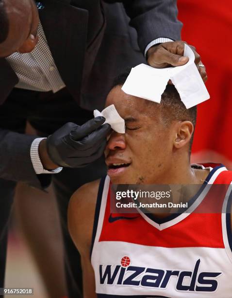 Tim Frazier of the Washington Wizards receives attention after cutting his forehead during a game against the Chicago Bulls at the United Center on...