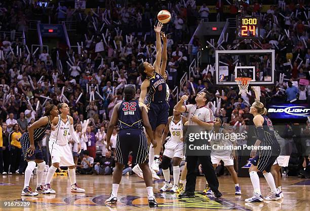 Tammy Sutton-Brown of the Indiana Fever jumps for a tip off against Tangela Smith of the Phoenix Mercury in Game Five of the 2009 WNBA Finals at US...