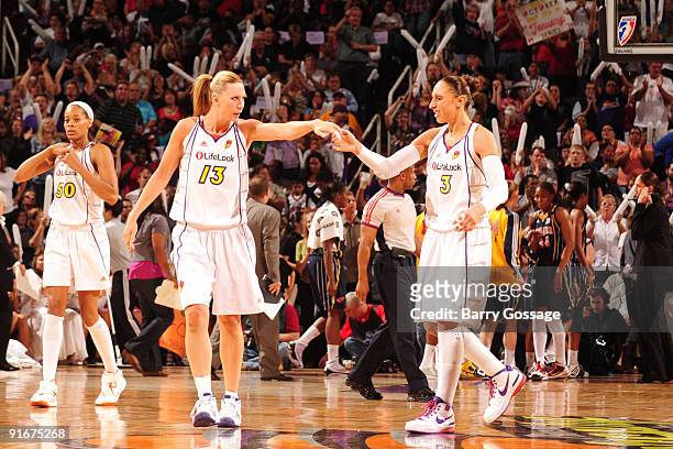 Penny Taylor and Diana Taurasi of the Phoenix Mercury congratulate each other on a good first half heading into the halftime break as the Mercury...
