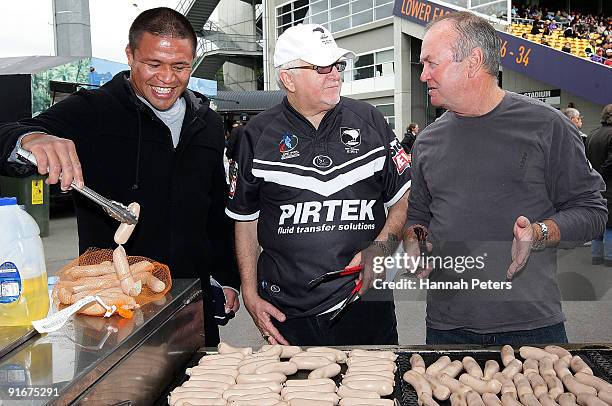 All Black Keven Mealamu, Peter Leitch and All Blacks head coach Graham Henry help cook sausages to raise money before the New Zealand Rugby League...