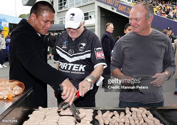 All Black Keven Mealamu, Peter Leitch and All Blacks head coach Graham Henry help cook sausages to raise money before the New Zealand Rugby League...
