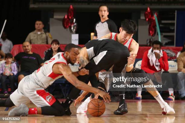 Markel Brown and Zhou Qi of the Rio Grande Valley Vipers go for a loose ball against the Austin Spurs during the NBA G-League on February 10, 2018 at...