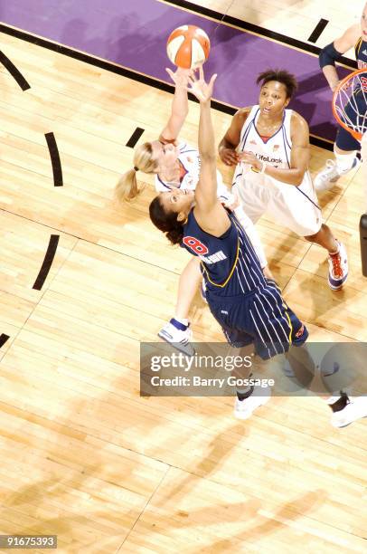 Penny Taylor of the Phoenix Mercury fights for a rebound with Tammy Sutton-Brown of the Indiana Fever in Game five of the WNBA Finals played on...