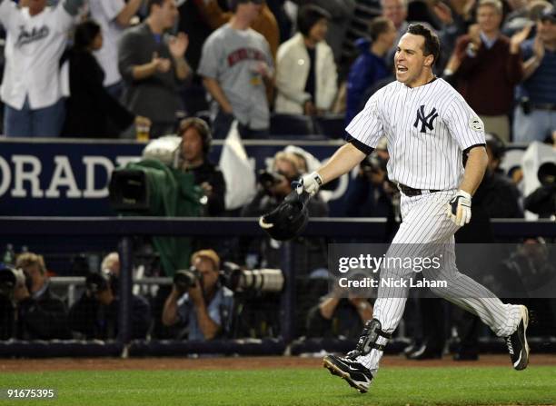 Mark Teixeira of the New York Yankees celebrates after hitting a walk off home run in the eleventh inning against the Minnesota Twins in Game Two of...