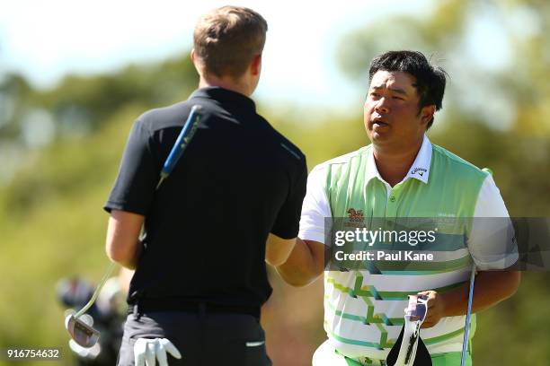 Kiradech Aphibarnrat of Thailand shakes hands with Ben Eccles of Australia after winning his round one match during day four of the World Super 6 at...