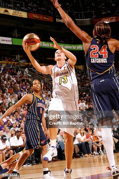 Penny Taylor of the Phoenix Mercury shoots against Tamika Catchings of the Indiana Fever during Game Five of the WNBA Finals on October 9, 2009 at US...