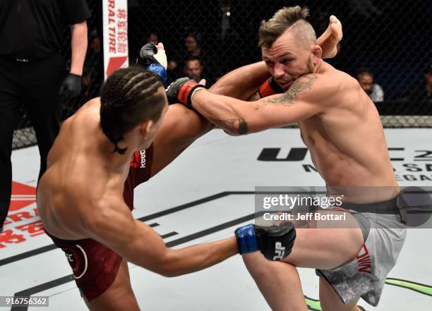 Dong Hyun Kim of South Korea kicks Damien Brown of Australia in their lightweight bout during the UFC 221 event at Perth Arena on February 11, 2018...