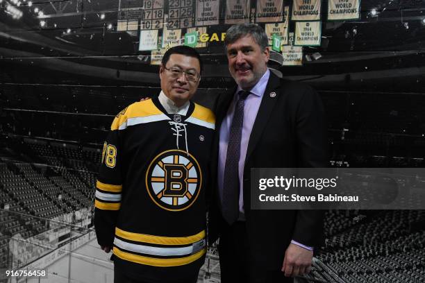 Chairman of ORG Packaging, Mr. Zhou Yungie poses for a photo with President of the Boston Bruins Cam Neely before the game against the Buffalo Sabres...