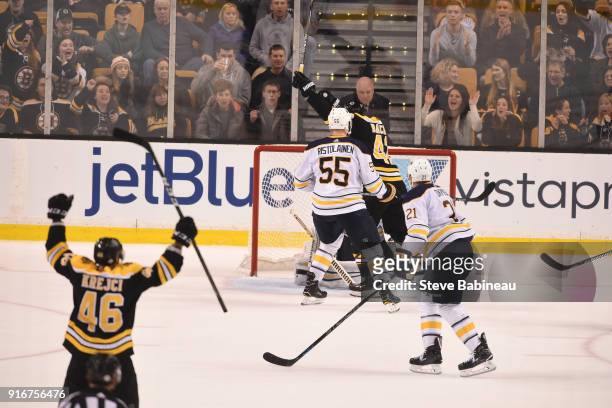 David Krjeci and David Backes of the Boston Bruins celebrate a goal against the Buffalo Sabres at the TD Garden on February 10, 2018 in Boston,...