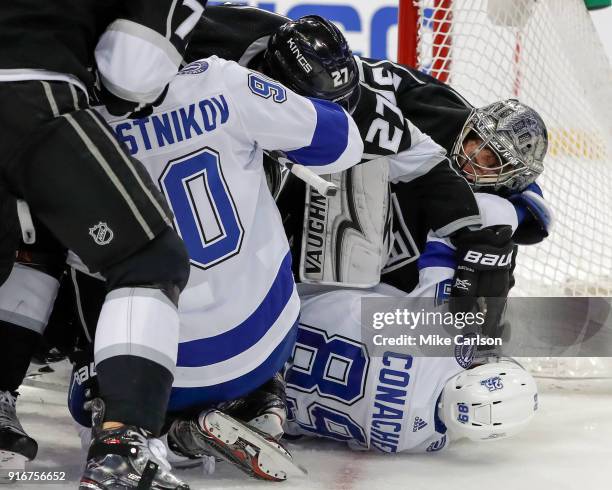 Cory Conacher of the Tampa Bay Lightning and Jonathan Quick of the Los Angeles Kings exchange punches at the Amalie Arena on February 10, 2018 in...
