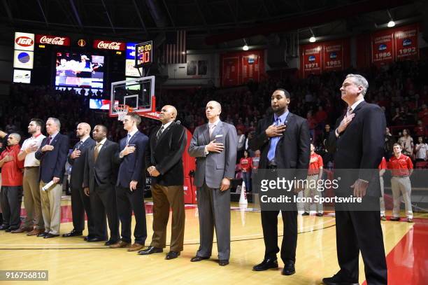 Western Kentucky Hilltoppers head coach Rick Stansberry and his staff stand for the National Anthem and sporting a Autism Pin during the first half...