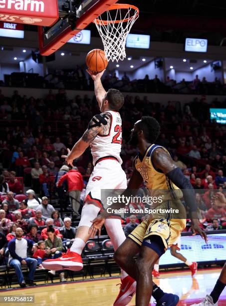 Western Kentucky Hilltoppers forward Justin Johnson goes up and under the backboard during the first half between the Florida International Golden...