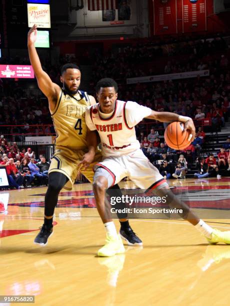 Western Kentucky Hilltoppers guard Lamonte Bearden gets cut off by Florida International Golden Panthers guard Brian Beard Jr. During the first half...