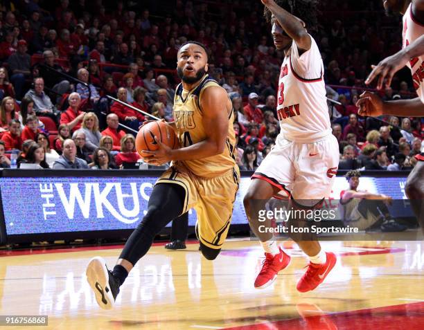 Florida International Golden Panthers guard Brian Beard Jr. Drives past Western Kentucky Hilltoppers guard Taveion Hollingsworth during the first...