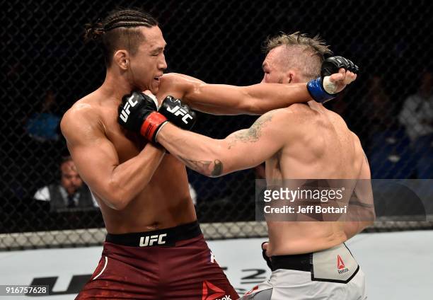 Damien Brown of Australia punches Dong Hyun Kim of South Korea in their lightweight bout during the UFC 221 event at Perth Arena on February 11, 2018...
