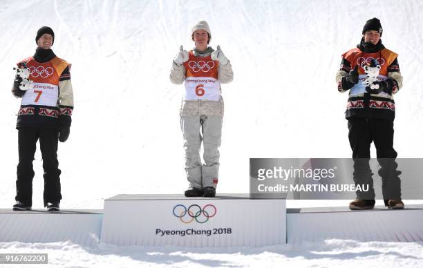 Silver medallist Canada's Max Parrot, gold medallist US Redmond Gerard and bronze medallist Canada's Mark McMorris celebrate during the victory...