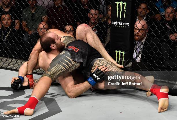 Tyson Pedro of Australia submits Saparbek Safarov of Russiain their light heavyweight bout during the UFC 221 event at Perth Arena on February 11,...