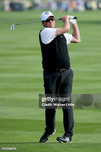Wayne Gretzky plays his shot on the 18th hole during Round Three of the AT&T Pebble Beach Pro-Am at Pebble Beach Golf Links on February 10, 2018 in...