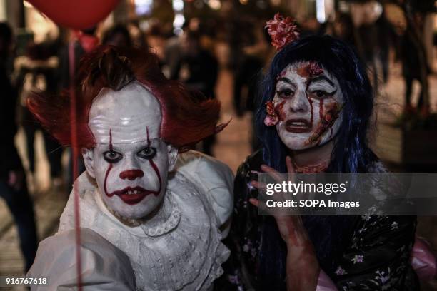 Participants seen dressed and used make-up to look like zombies take part in the event. People dressed up as zombie took to the streets of Athens for...