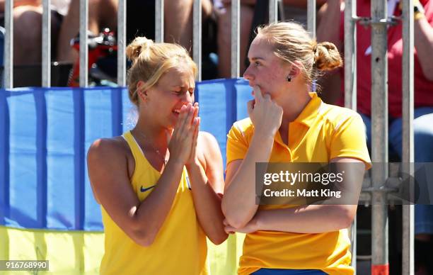 Marta Kostyuk and Dasha Lopatetskaya of Ukraine watch the singles match between Daria Gavrilova of Australia and Nadiia Kichenok of Ukraine during...