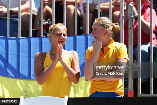 Marta Kostyuk and Dasha Lopatetskaya of Ukraine watch the singles match between Daria Gavrilova of Australia and Nadiia Kichenok of Ukraine during...