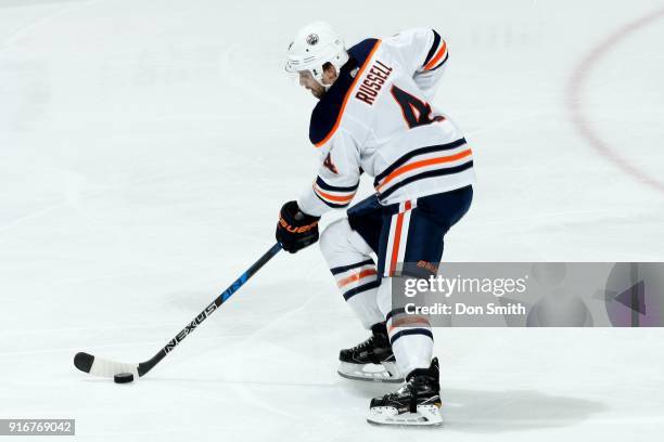 Kris Russell of the Edmonton Oilers handles the puck during a NHL game against the San Jose Sharks at SAP Center on February 10, 2018 in San Jose,...