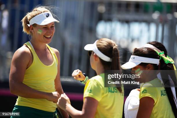 Daria Gavrilova of Australia celebrates winning a point with team mates in her singles match against Nadiia Kichenok of Ukraine during the Fed Cup...