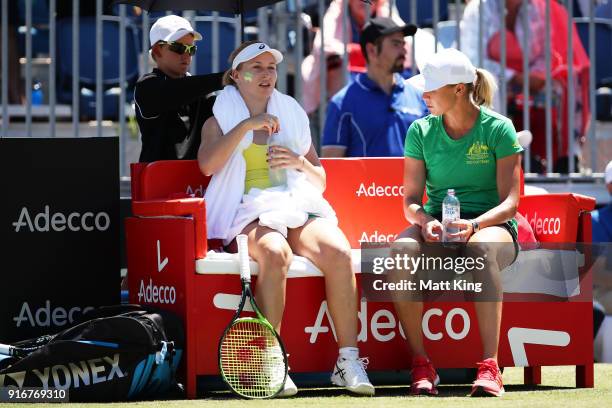 Daria Gavrilova of Australia talks to Australia captain Alicia Molik between games in her singles match against Nadiia Kichenok of Ukraine during the...