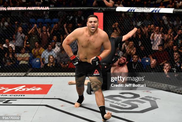 Tai Tuivasa of Australia celebrates his victory over Cyril Asker of France in their heavyweight bout during the UFC 221 event at Perth Arena on...