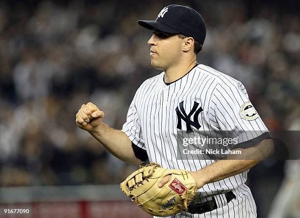 Mark Teixeira of the New York Yankees reacts against the Minnesota Twins in Game Two of the ALDS during the 2009 MLB Playoffs at Yankee Stadium on...
