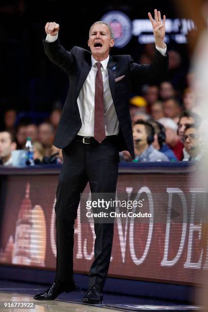 Head coach Andy Enfield of the USC Trojans gestures during the first half of the college basketball game against the Arizona Wildcats at McKale...